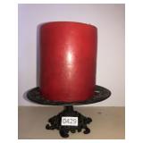 Cast iron candle stand with candle