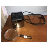 Magnifying glass and Sony radio alarm clock