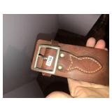 Leather ammo belt with 16 rounds of ammo