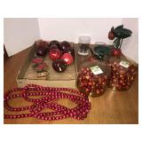 Faux apples, candle stands, tree garland