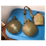 2 plastic round cantines and 1 aluminum cantine