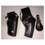 2 leather holsters and key ring holder