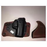 2 leather and metal holsters