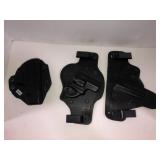 3 metal and leather holsters