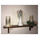 Small wall shelf with sympathy candles and angel