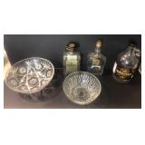 2 large bowls and glass bottles