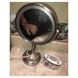 Light up makeup mirror and toothbrush holder