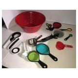 Plastic bowl, measuring cups, pizza cutter