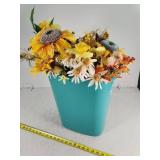 Blue Trash Can With Artificial Flowers