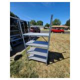 Metal Shelving Unit With Checkerboard Shelves