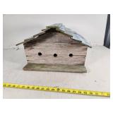 Rustic Wooden Birdhouse in Need of Repair