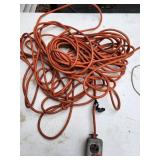 Damaged Orange Extension Cord with Outlet Box