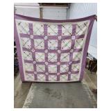 Hand-Stitched Quilt with Purple Border and Patchwo
