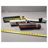 Four Toy Trucks with Trailers