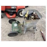 Tub full of fittings and fertilizer spreader