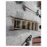 Metal ramps in wooden ladder