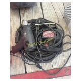 Heat gun, saw, and electric cord