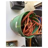 Bucket with two extension cords