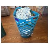 Basket of table cloths and runners mats