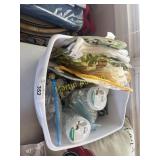 Tub of heat pads, decorations, and glass gens