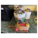 Three cookie jars and wall decoration