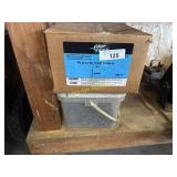 Box of plastic cap nails and roofing nails