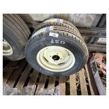 Pair of un-used batwing mower tires and wheels.