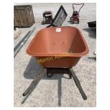 Big orange wheel barrel