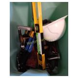 Tote of tools and helmet