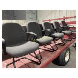 Five black and gray office chairs