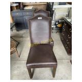 Two brown leather chairs