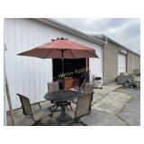 Outside patio table plus chairs and umbrella