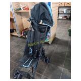 Umbrella stroller with shade and cup holders