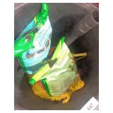 Trash can and garden supplies