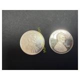 2- 1 oz Silver coins  TK