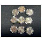 Uncirculated quarters and one dollar piece  TK