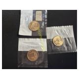 Three uncirculated Sacagawea dollars   TB