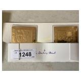 Two Gold colored Collectible Cards