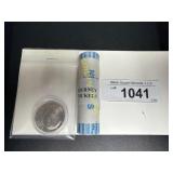 1980 Kennedy half dollar and a roll of Westward TM
