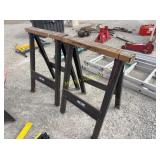 Pair of Iron Horse folding sawhorses with wood top