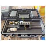 Plastic toolbox with assorted plumbing tools and f