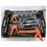 Crate full of Caulk Guns
