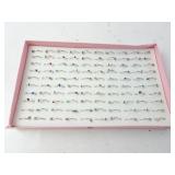 Lot of 100 New Costume Jewelry Rings in Holder -