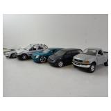 Five 1:24 Die Cast Cars