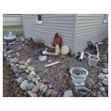 Lot of Decorative Items Behind Garage