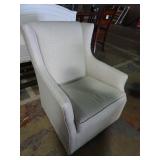 White Upholstered Gliding Swivel Rocking Chair