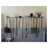 Lot of Misc Yard Tools on Garage Wall - Shovel