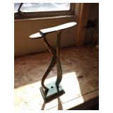 Vintage brass shoeshine footrest.