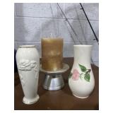 Lenox bud vases and a pillar candle on a stand