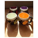 Group of hand-painted mugs, signed by artist.